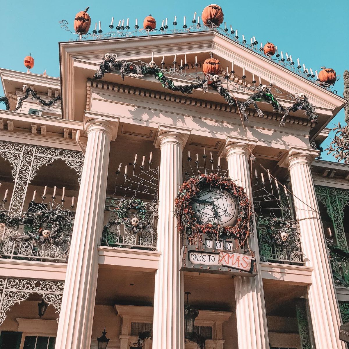 haunted mansion decorated for halloween and christmas